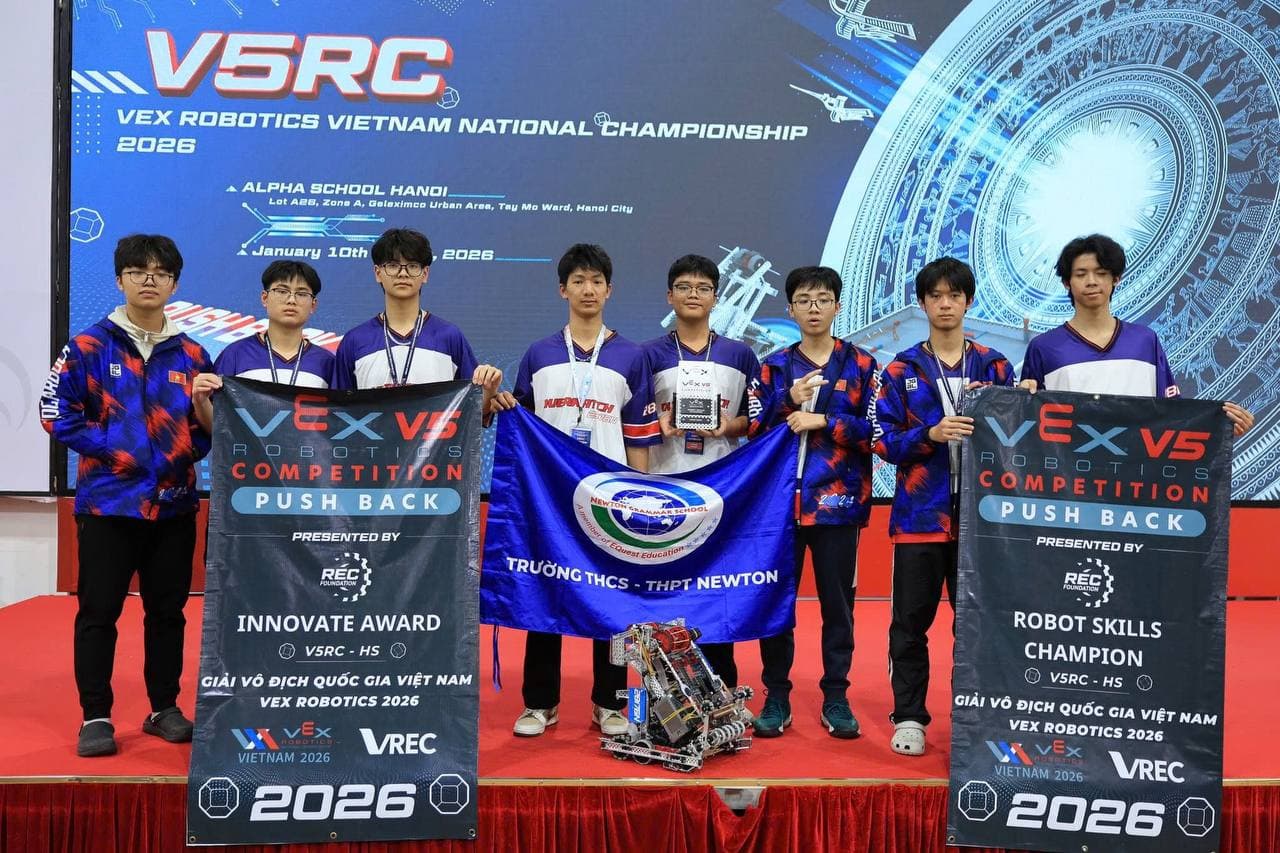 Team Overwatch with the Innovate Award and Robot Skills Champion banners at the national final